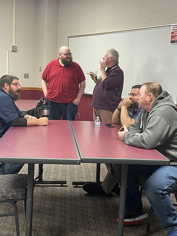 Employees conversating at table